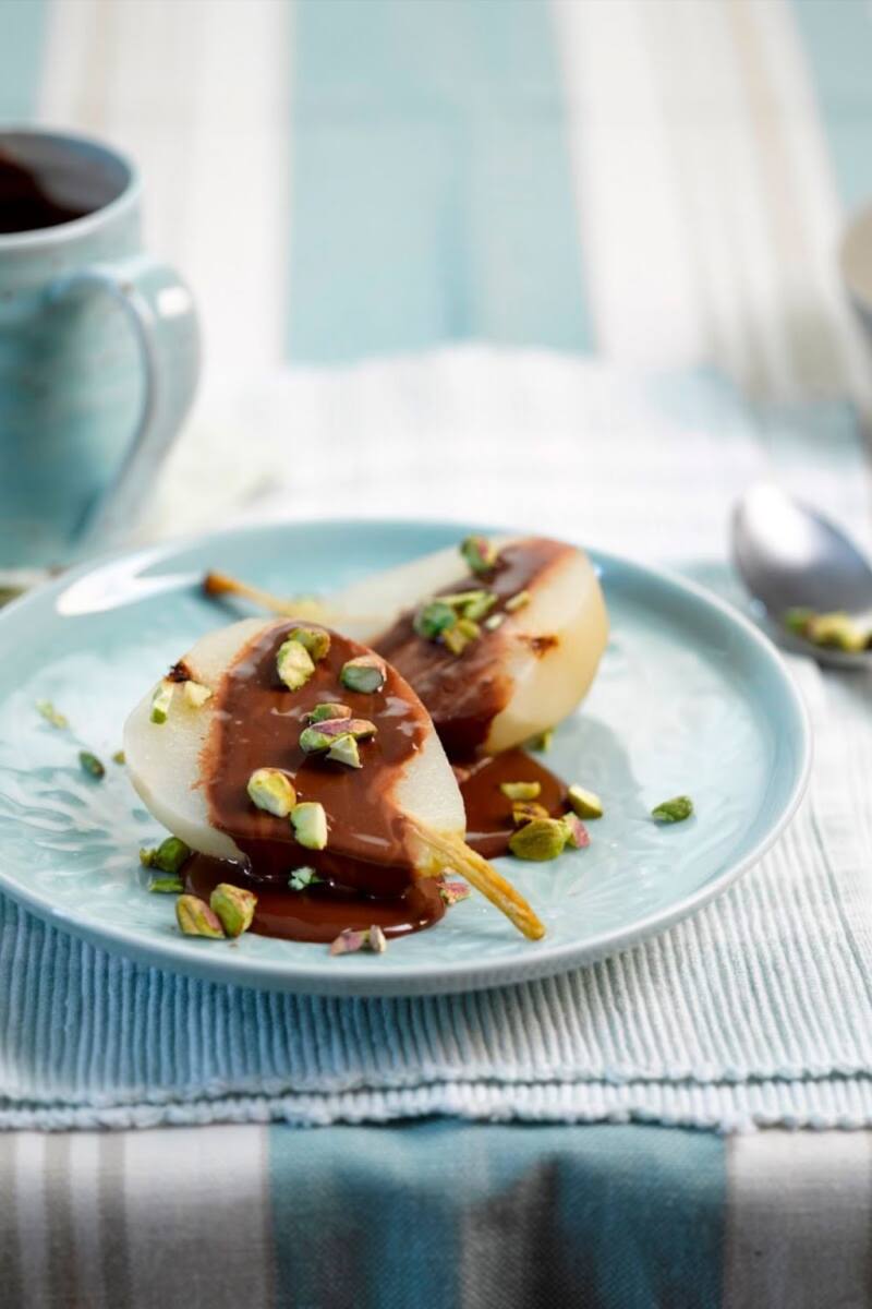 Poached Pears With Chocolate Sauce And Pistachios