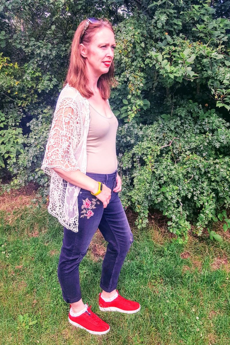 Faded Ripped Jeans With Roses On And Holes In Knee