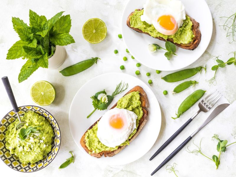 Avocado, Peas And Feta On Toast With Poached Eggs