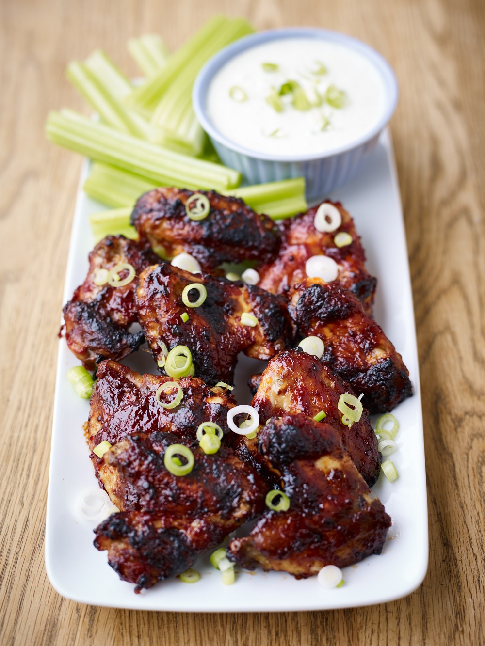 Sticky Chicken Wings With A Spring Onion And Celery Blue Cheese Dip.