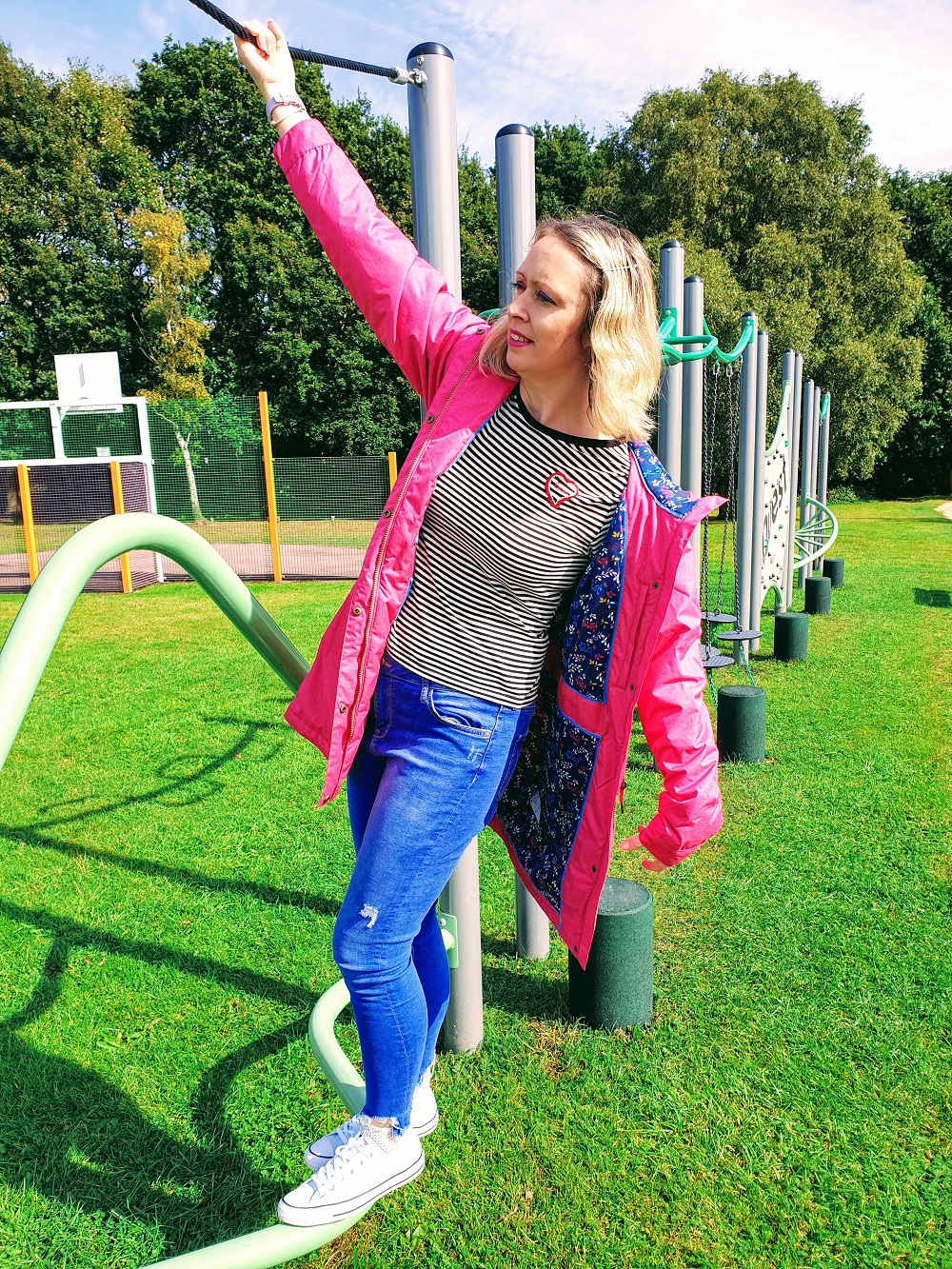 Welcoming Autumn In With A Lighthouse Pink Raincoat. Welcoming Autumn In With A Lighthouse Pink Raincoat.