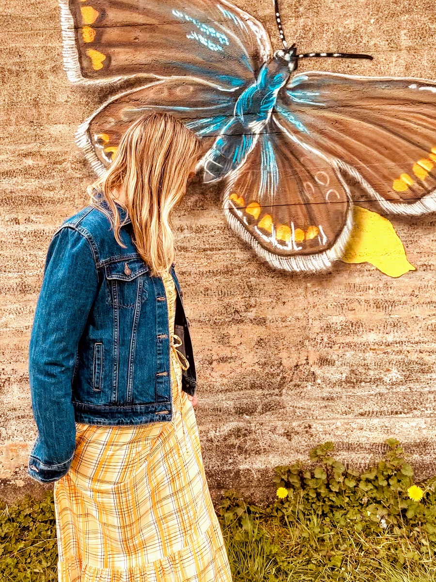 Denim Jacket, Yellow Maxi Dress And A Beautiful Butterfly Street Art. Beautiful Butterfly Street Art