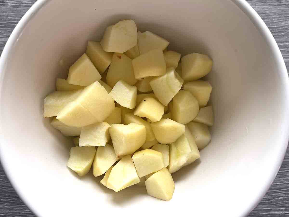 chopped apples in a bowl with lemon juice.