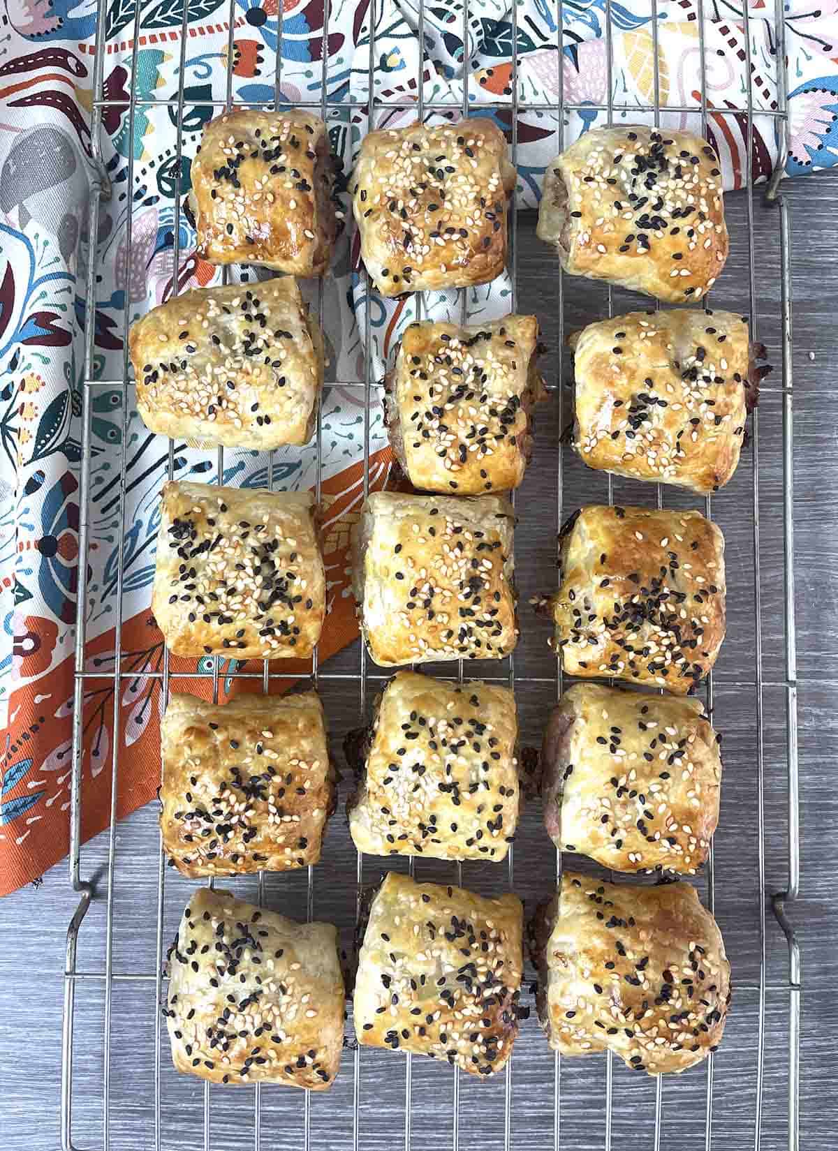 baken sausage rolls on a rack.