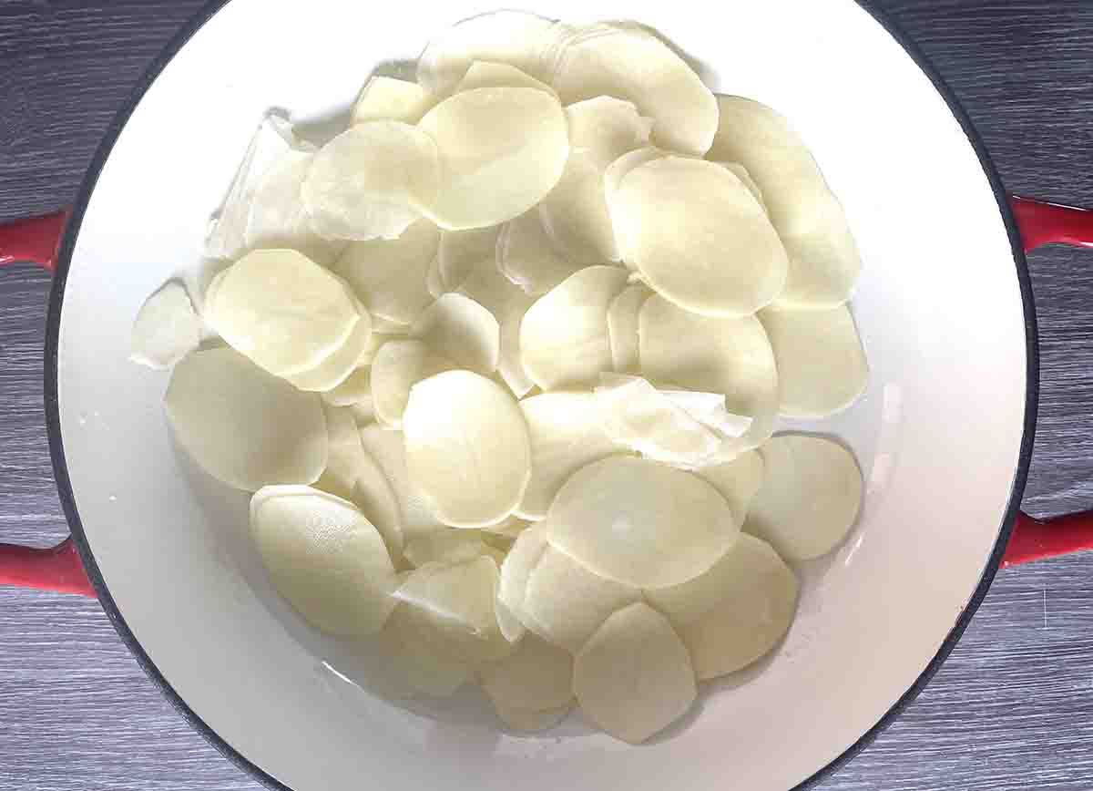 potatoes layered in a dish.