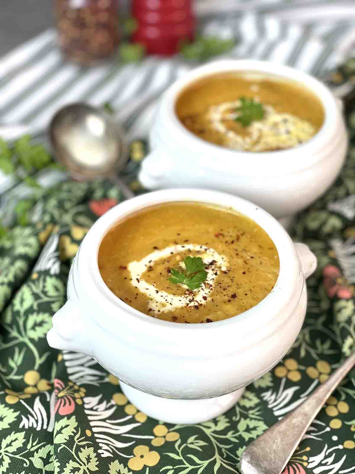bowls of spicy carrot soup.