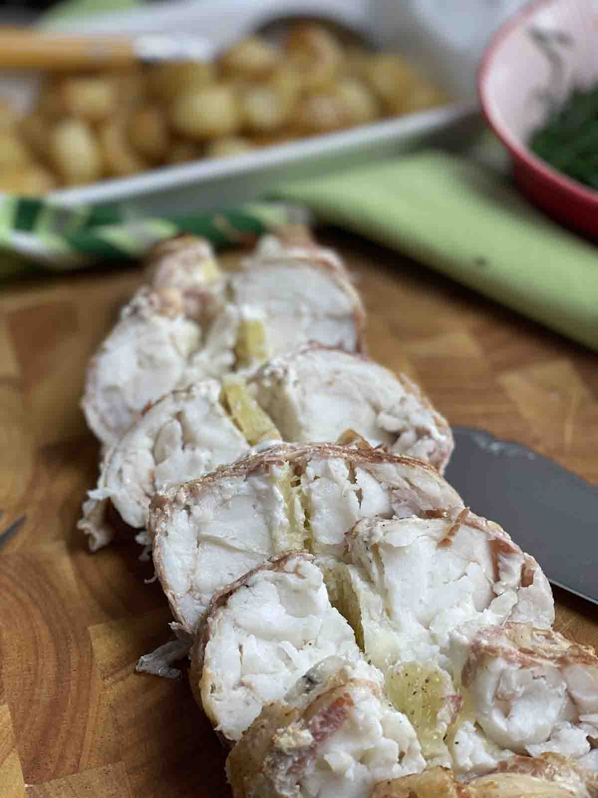 sliced fish on a board.