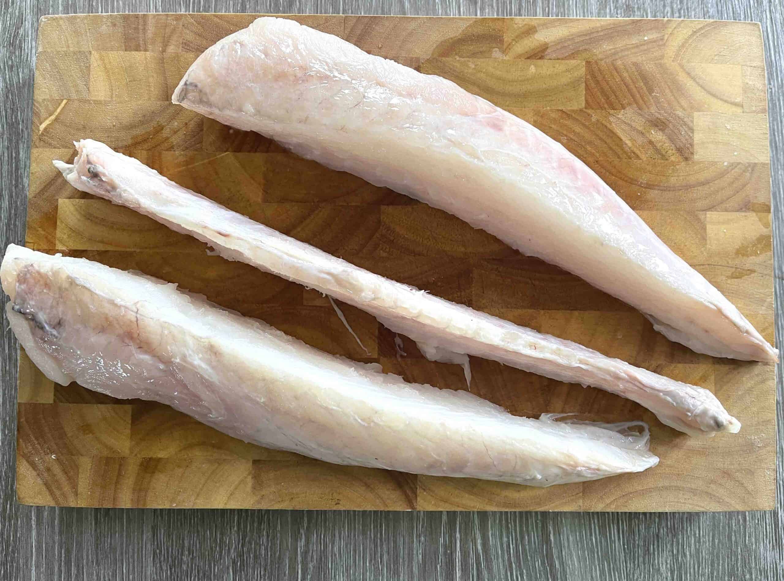 tail filleted on a board.