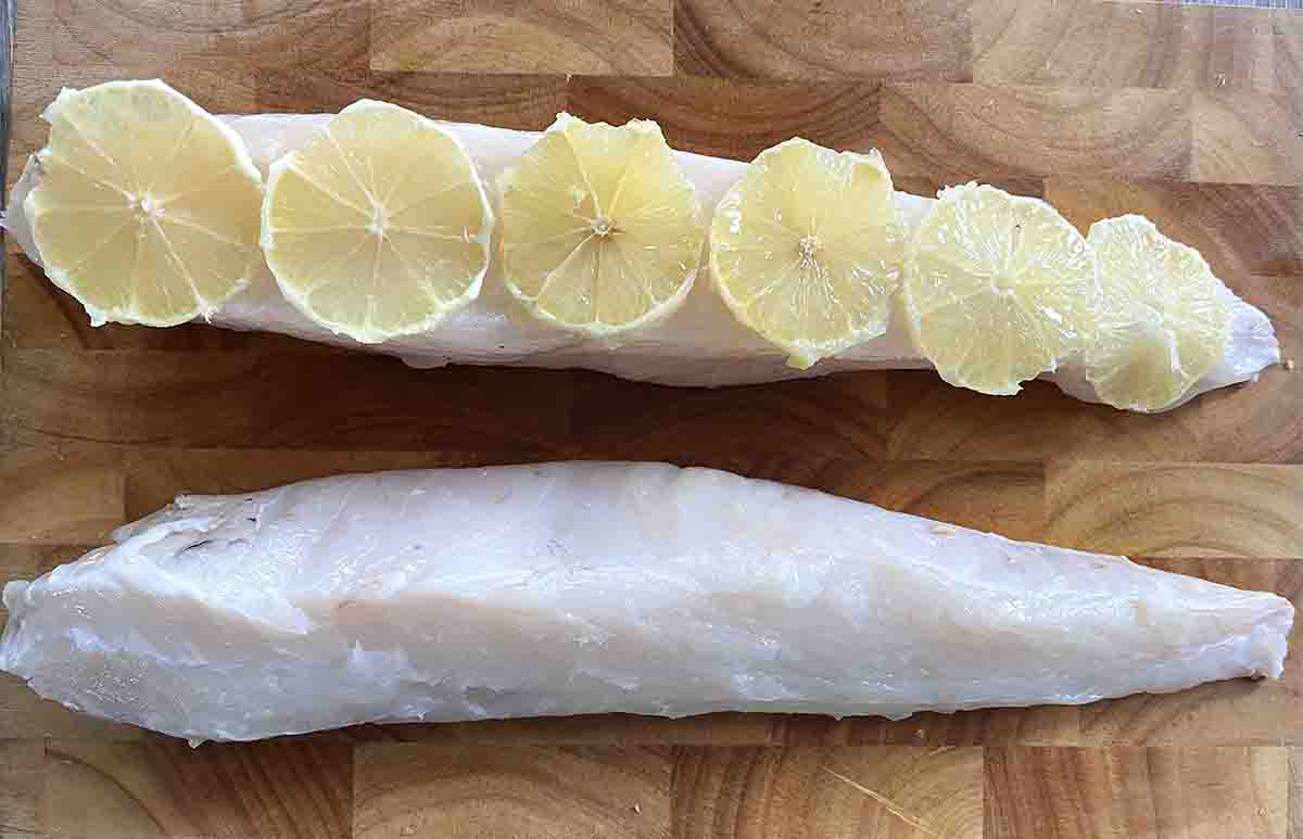 fillet with sliced lemons on top.