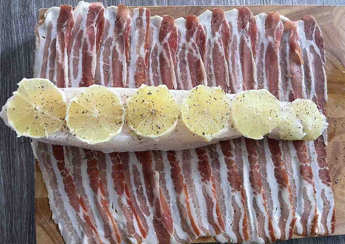 fish on slices of bacon.