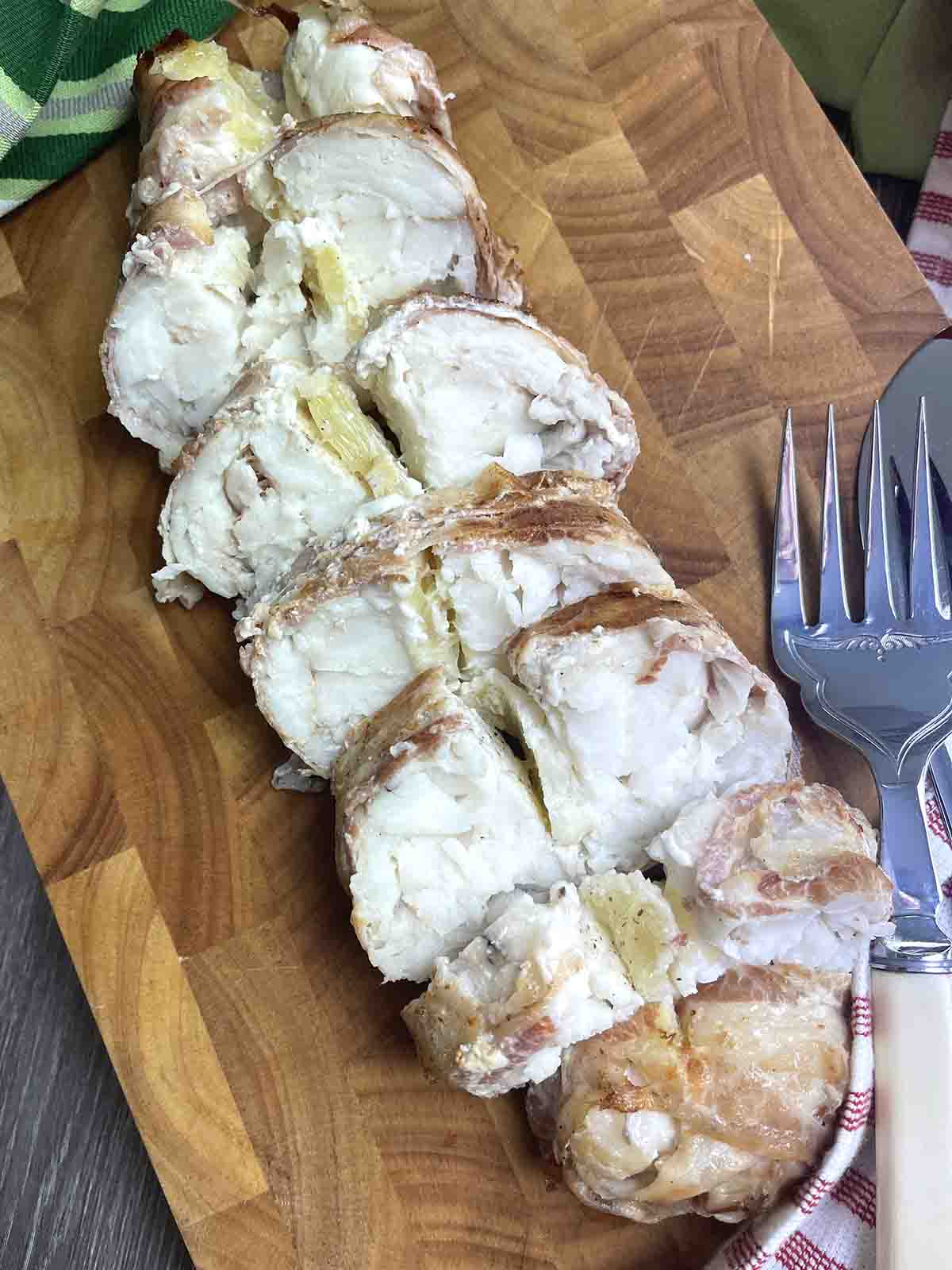 sliced poor man's lobster fish on a board.