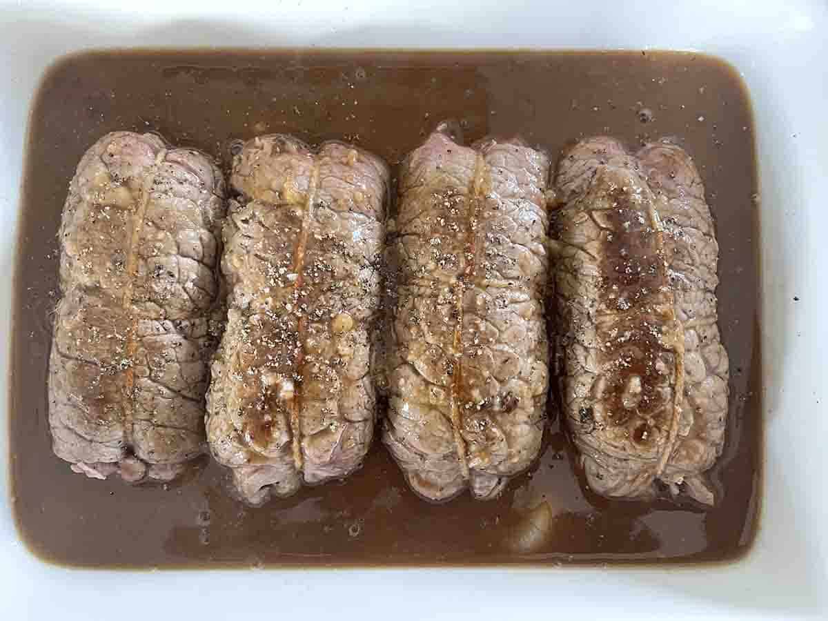 stuffed beef with sauce ready for the oven.