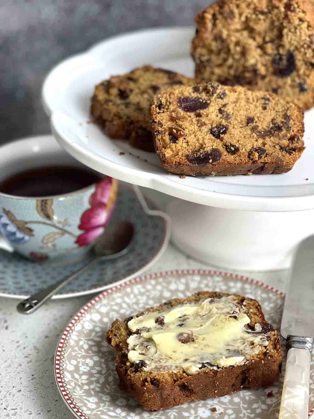 buttered slice of fruit loaf and cup of tea.