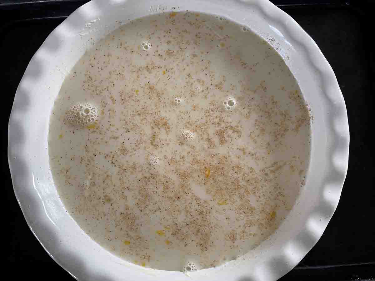 custard mixture in a pie dish.