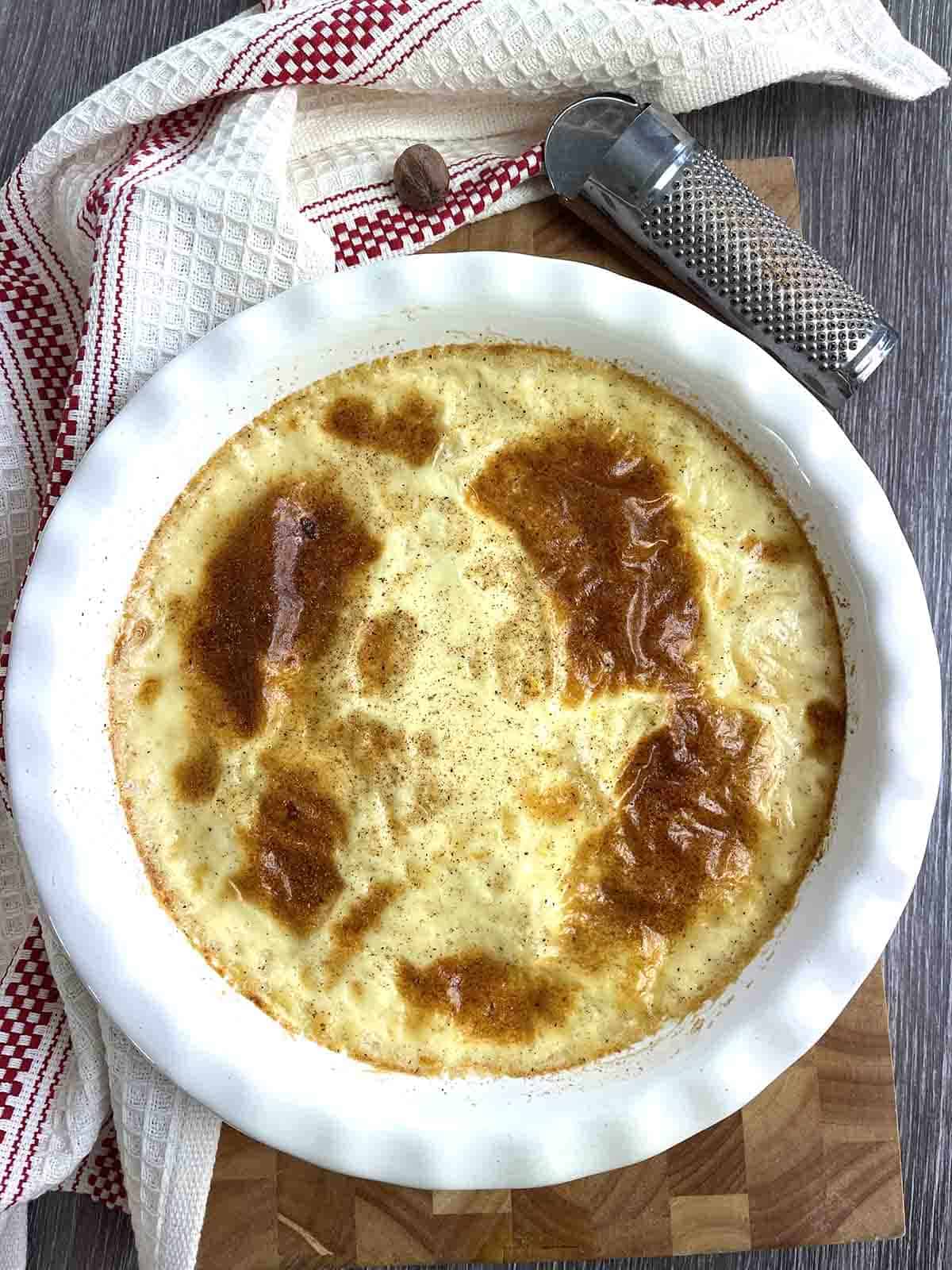 macaroni pudding in a round pie dish.