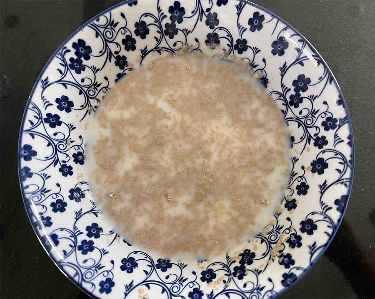 yeast milk and sugar mixture in a bowl.