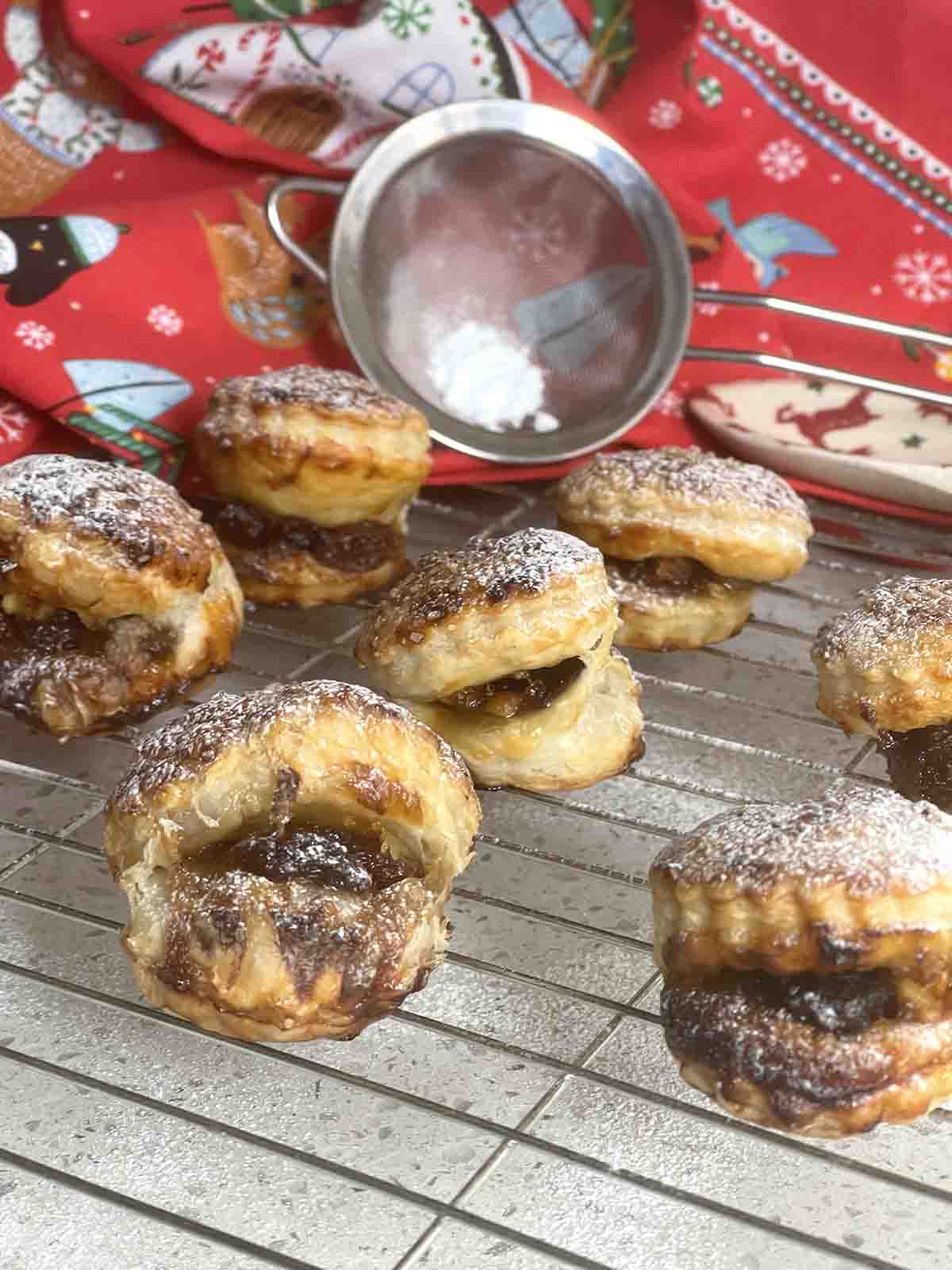 mince pies on a cooling rack.