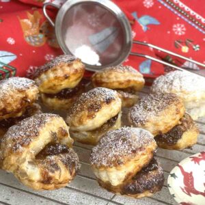 puff pastry mince pies on a cooling rack.