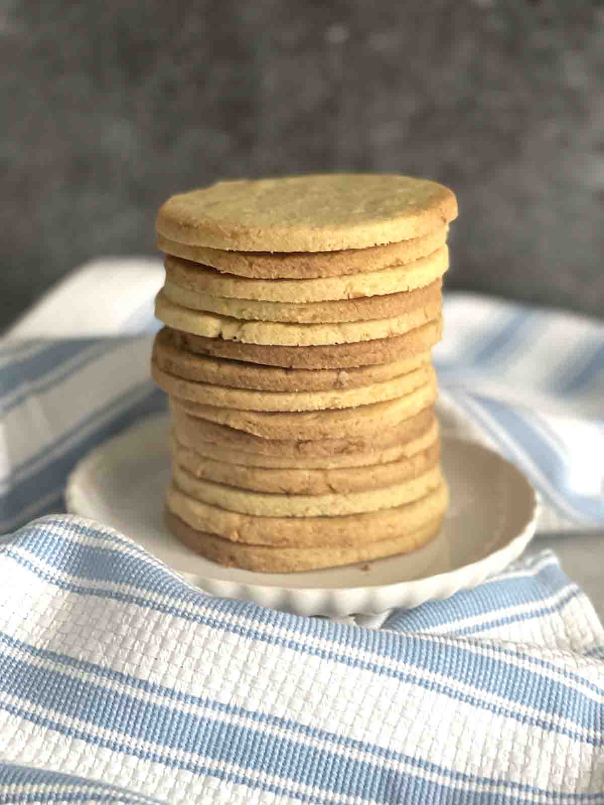 stack of shrewsbury biscuits on a plate.