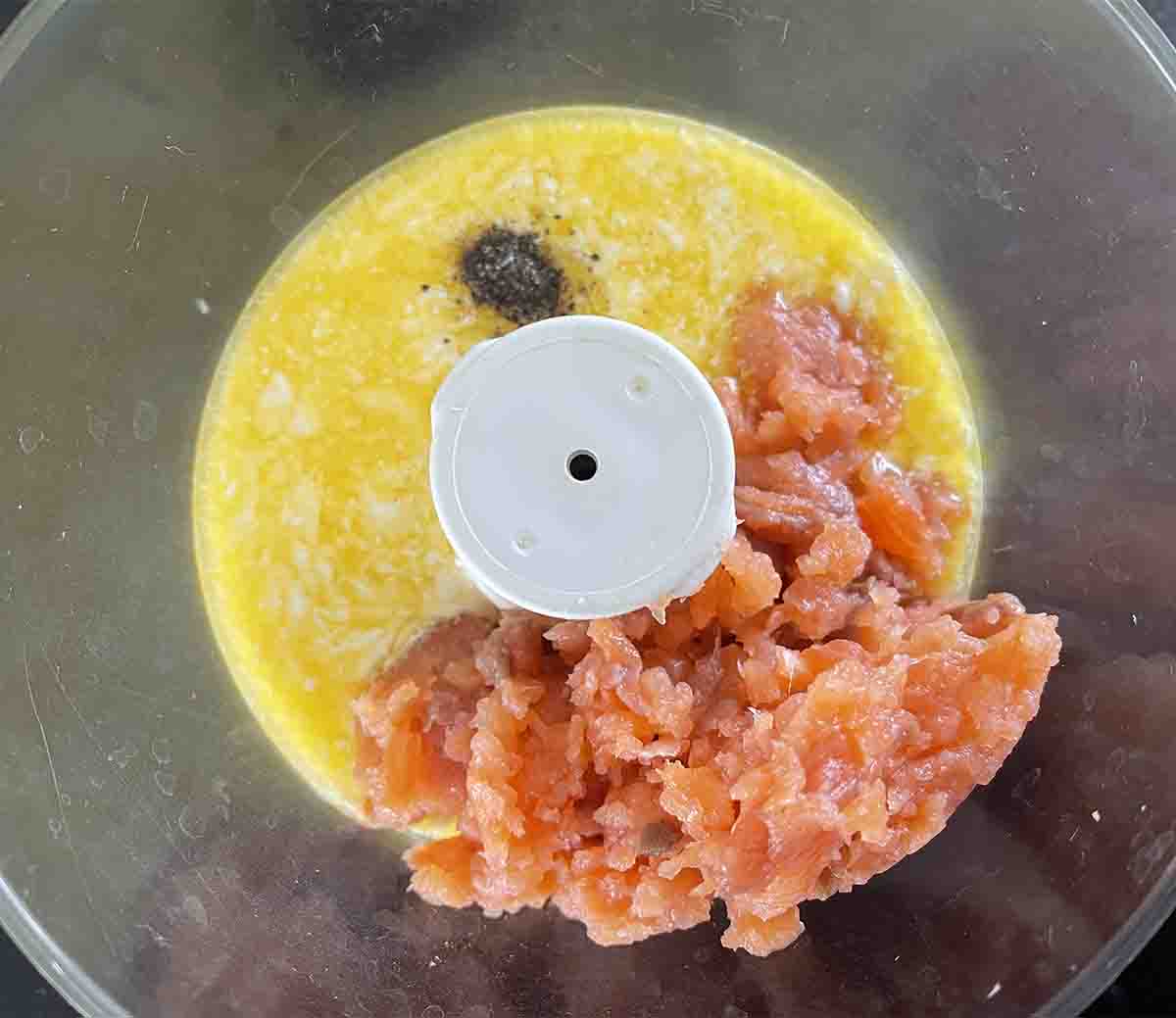 smoked salmon trimmings and melted butter in a food processor bowl.
