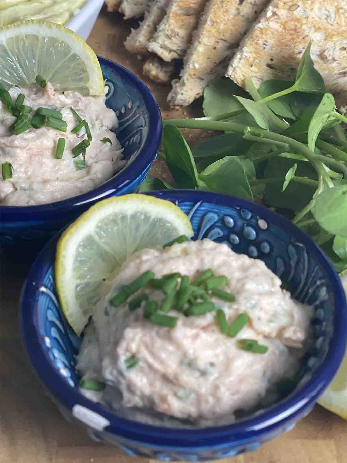pot of smoked salmon pâté with watercress in the background.