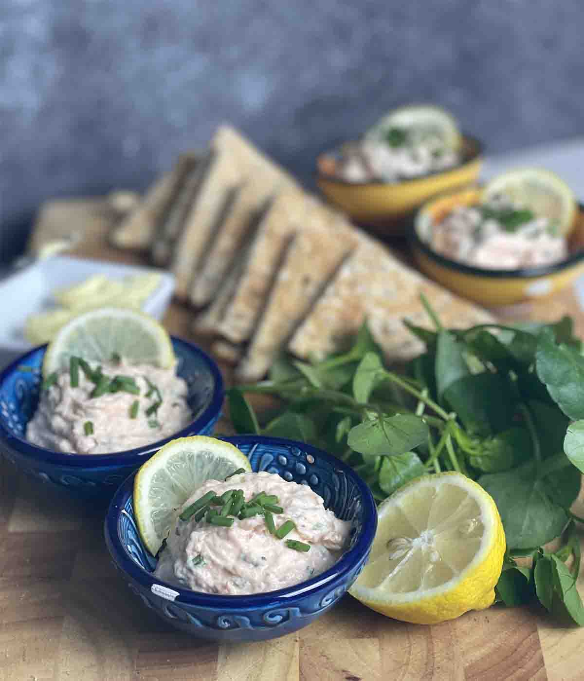 pots of pate with toast, lemon and watercress in the middle.