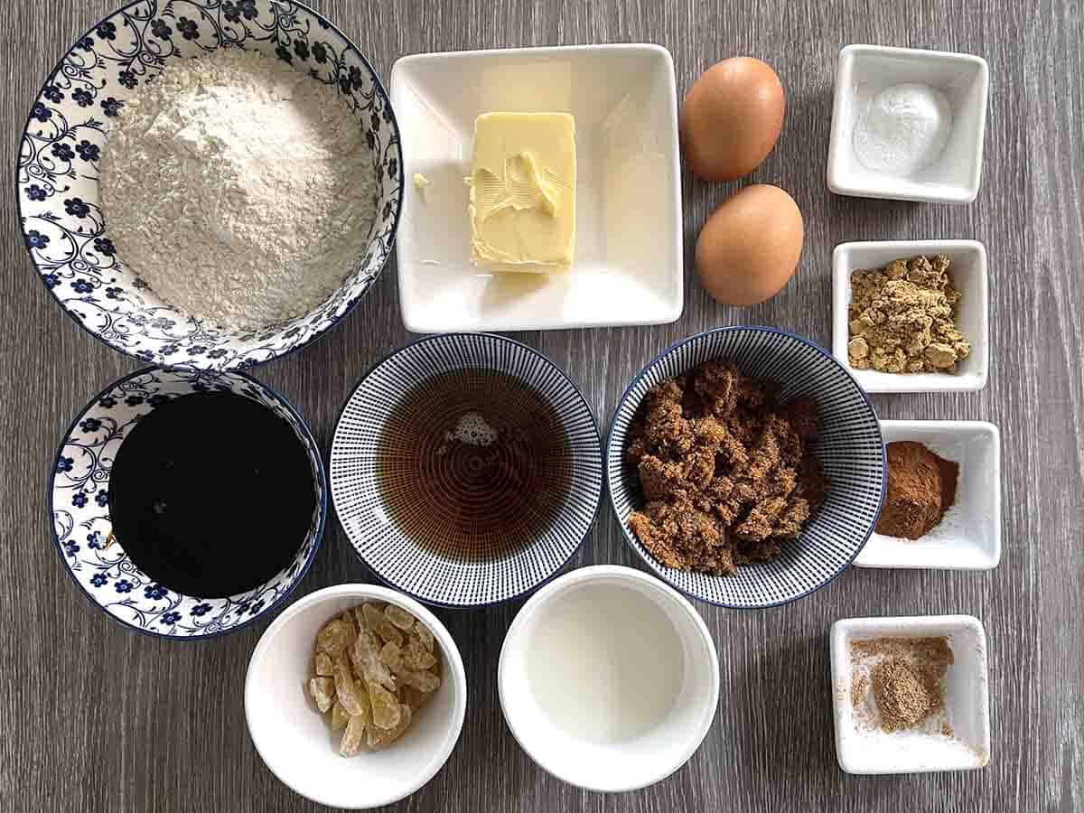 cake ingredients including, treacle, syrup, flour, butter, ginger, milk, sugar and eggs.