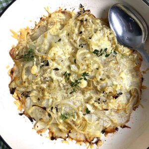 pan haggerty potato dish in a cast iron dish.