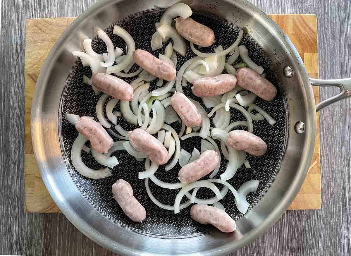 sliced onions and mushrooms in a frying pan.