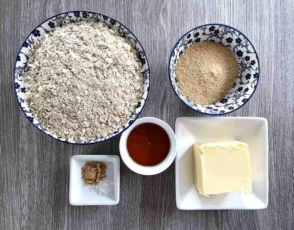 ingredeints in dishes including oats, golden syrup, butter, sugar and ground ginger.