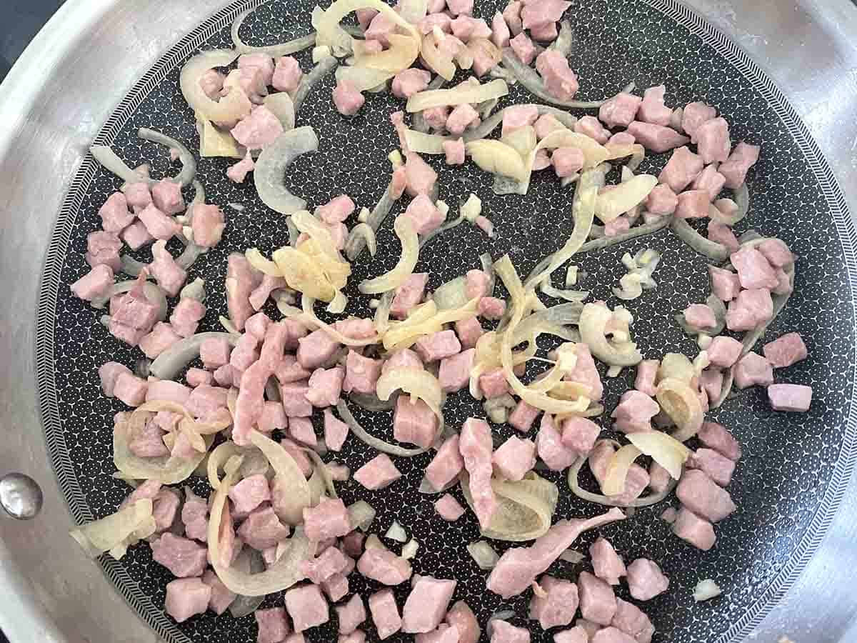 bacon frying with the onions.