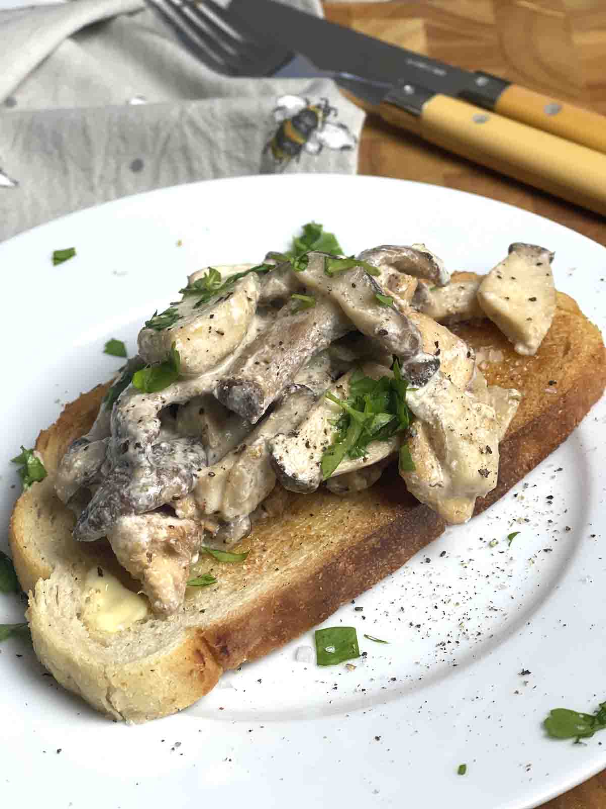 topped toast on a plate close up view.