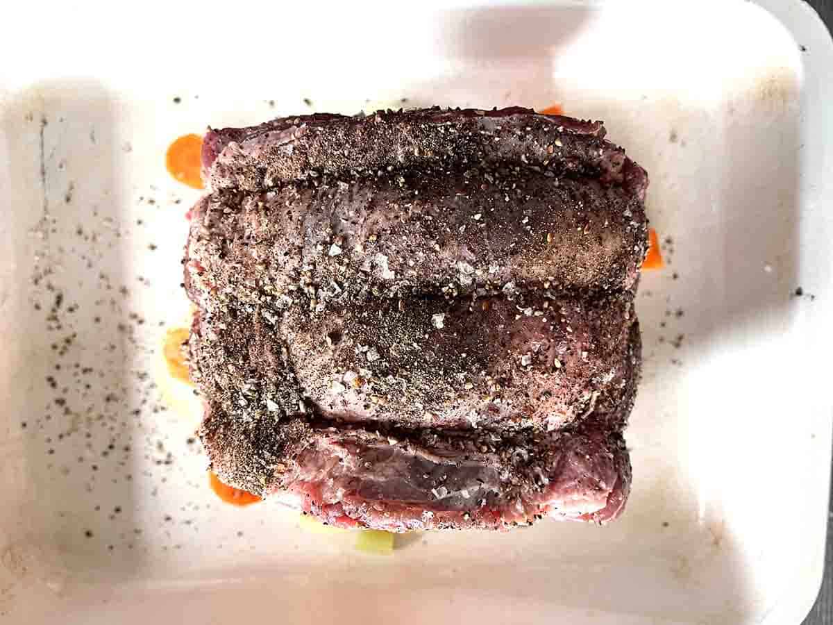 beef joint covered in pepper.