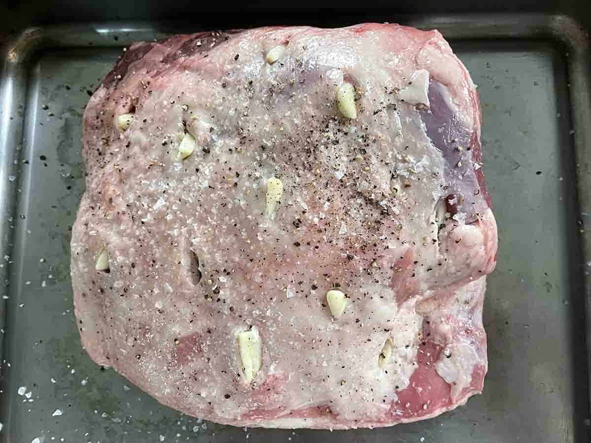 lamb shoulder studded with garlic.