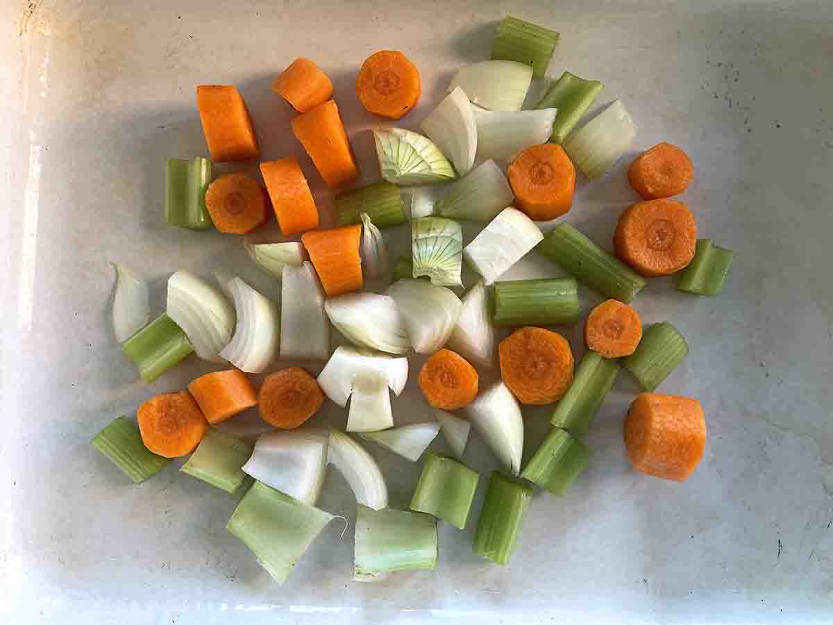 chopped carrots, celery and onion in an oven dish.