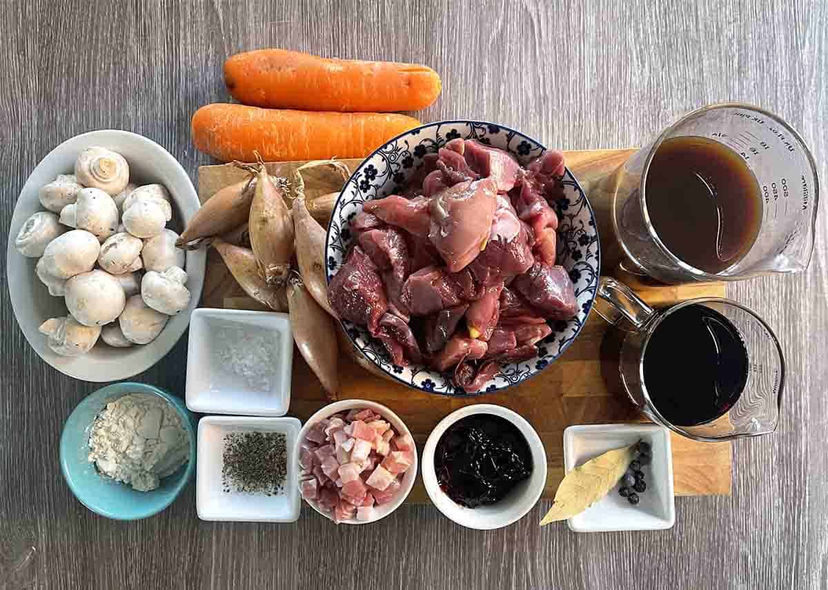 ingrdients including game, shallots, mushrooms, carrots, bay leaves thyme, stock and redcurrant jelly.