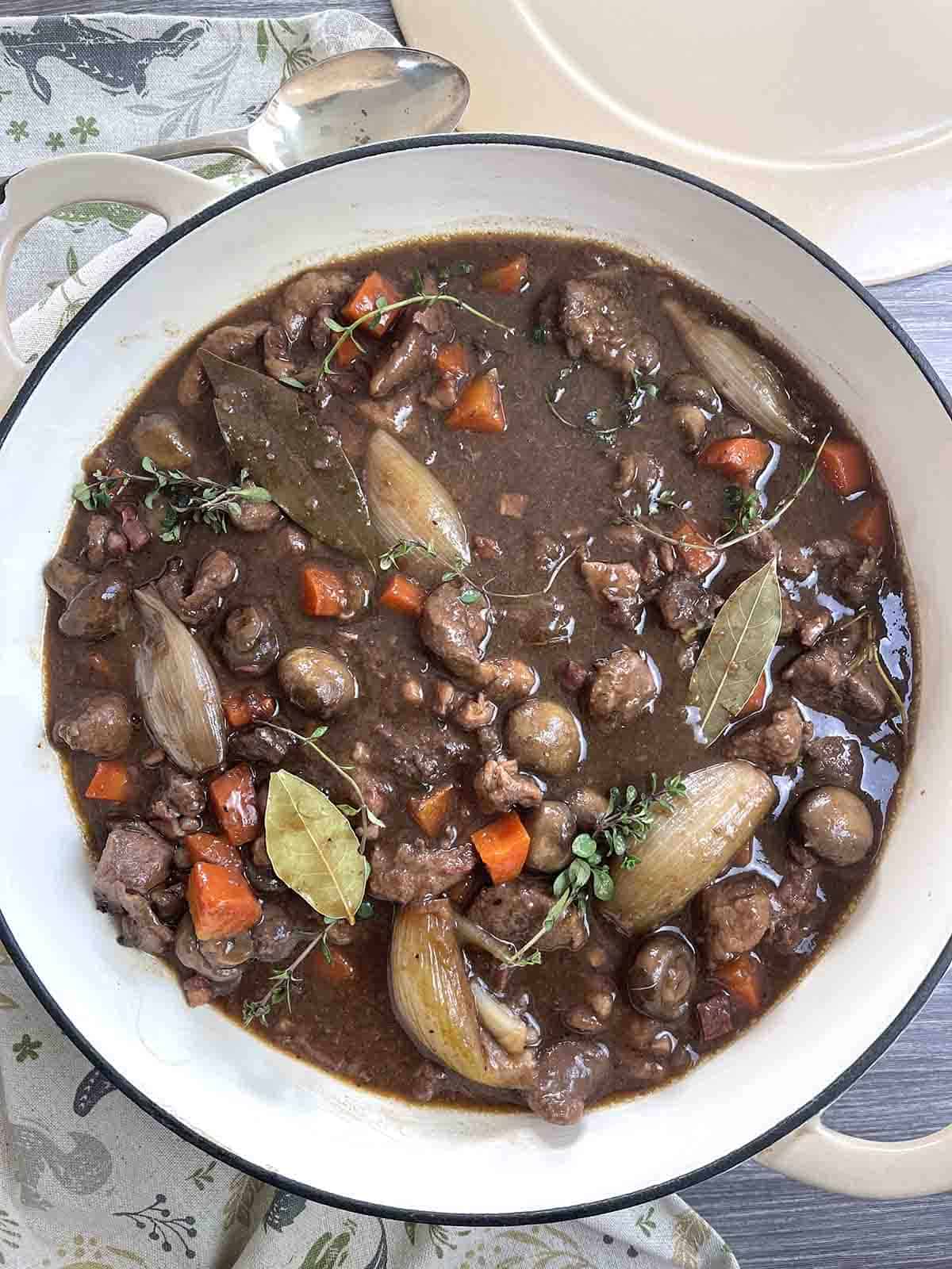 pheasant and venison casserole in a large pan.