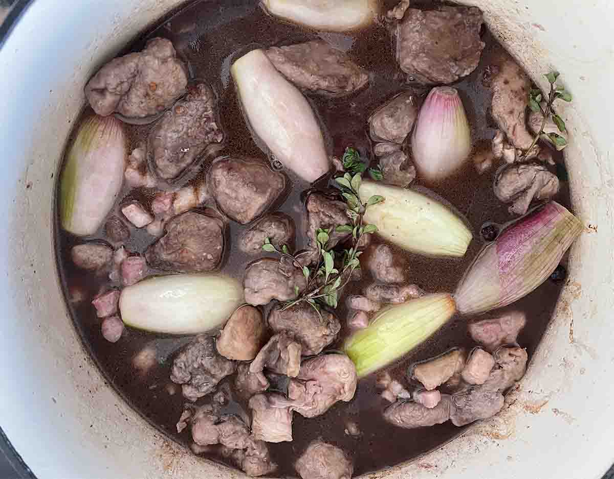 meat and stock added to shallots.