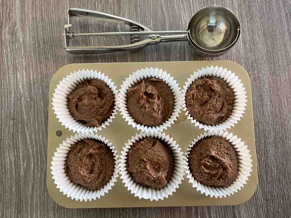 cake mix divided between muffin cases.