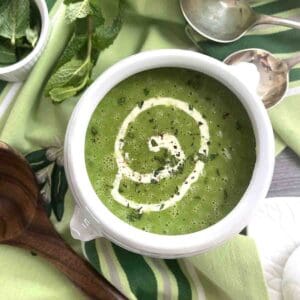 pea and mint soup in a white bowl.