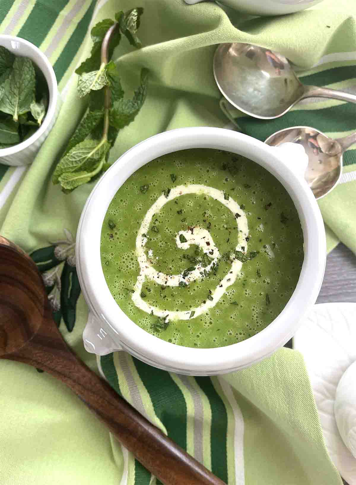 pea and mint soup in a white bowl.