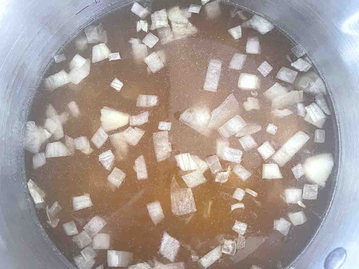 potato and stock added to the saucepan.