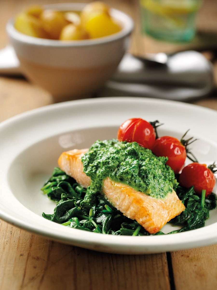 Salmon with Creamed Spinach Sauce on Wilted Kale. Salmon with Creamed Spinach Sauce on Wilted Kale.