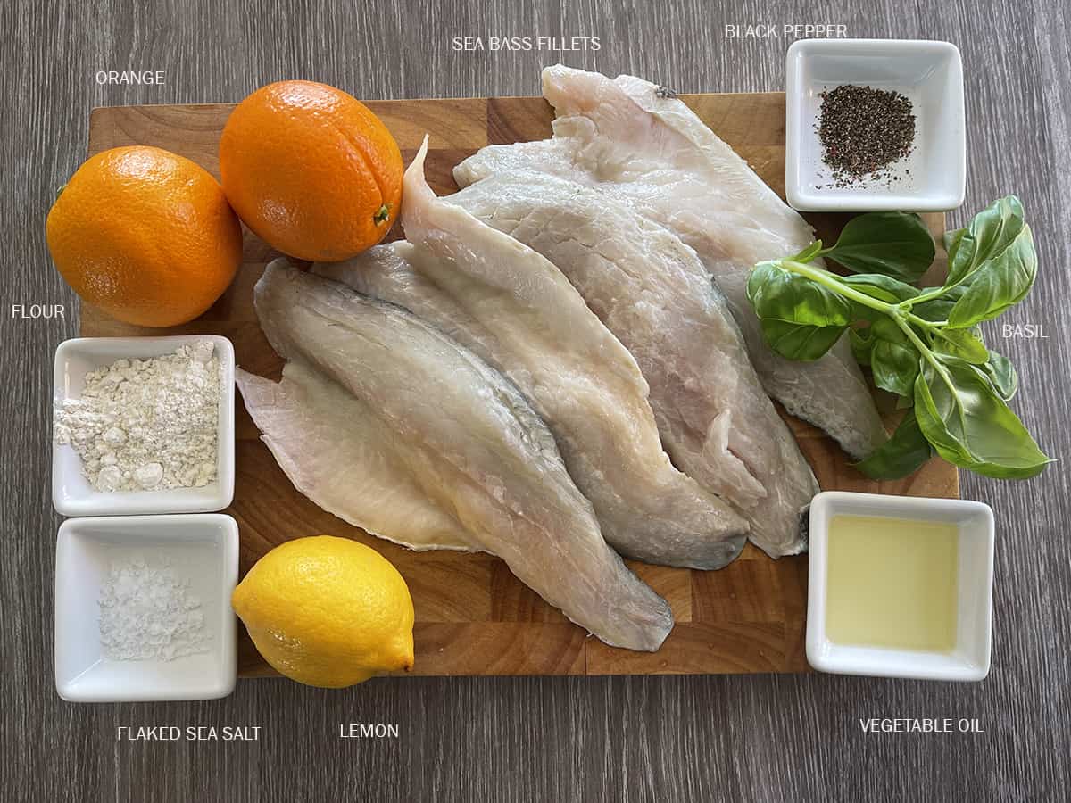 ingredients including sea bass, oranges, lemon, seasoning, oil and basil.