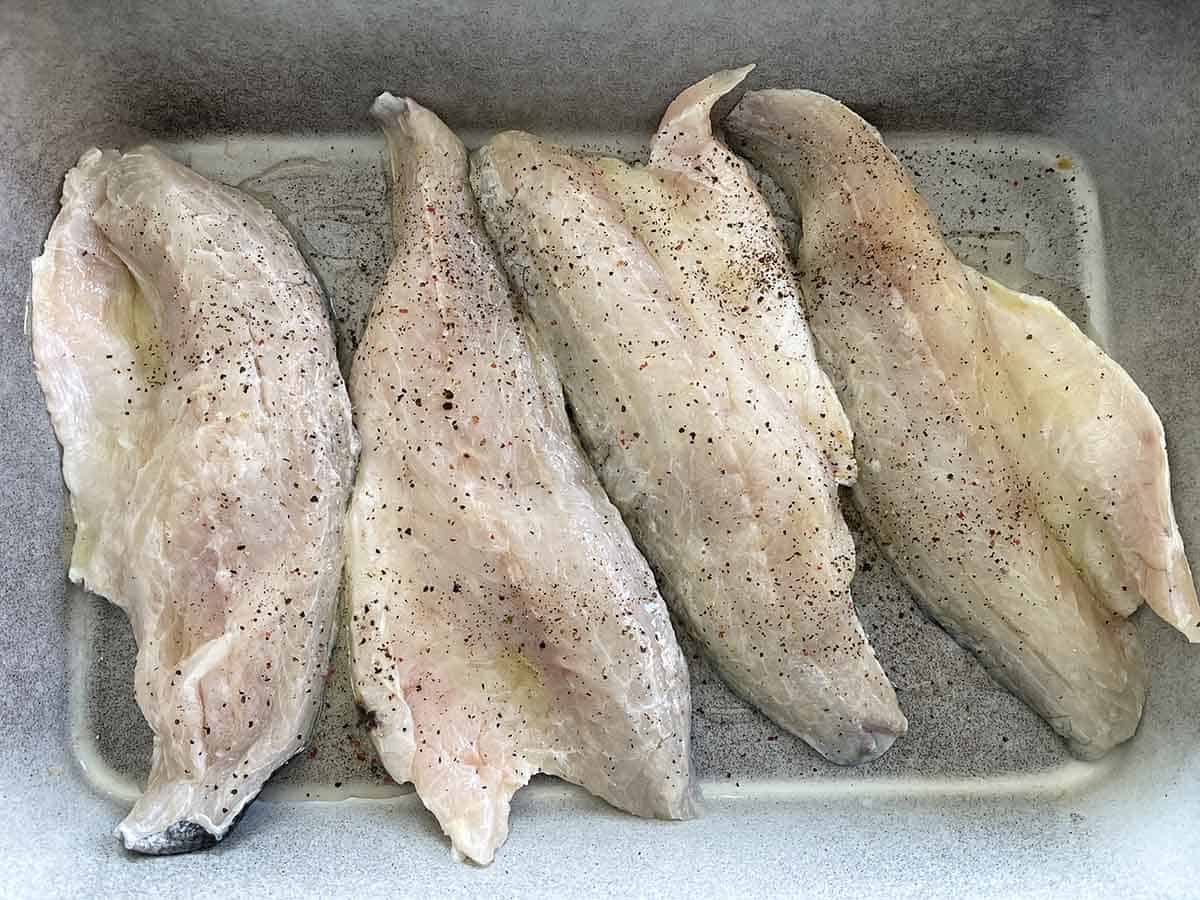 sea bass fillets in a dish.