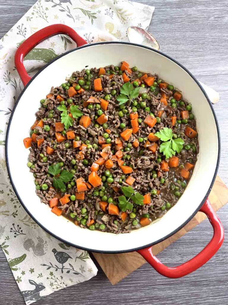 savoury mince in a red pan.