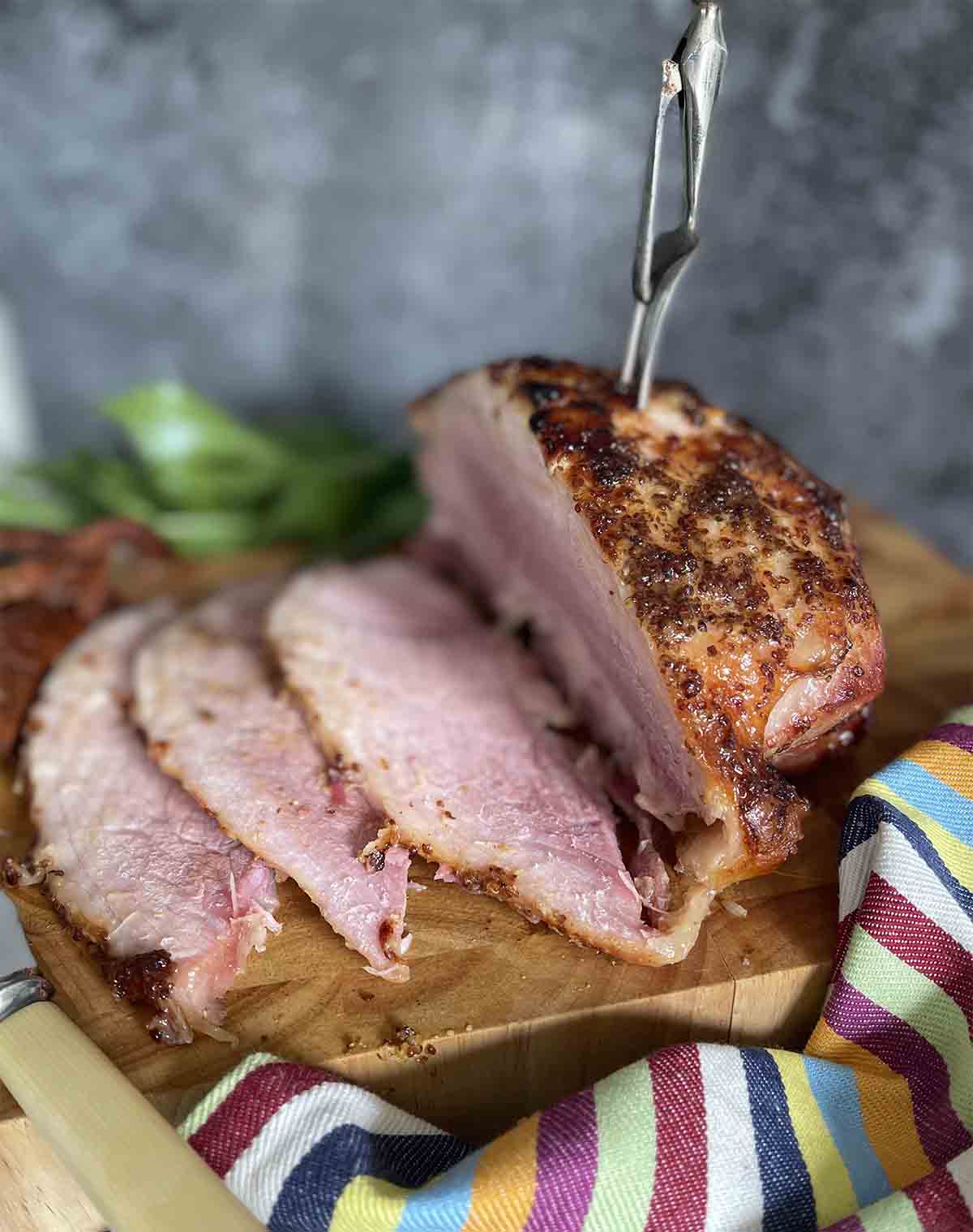 sliced gammon on a board.