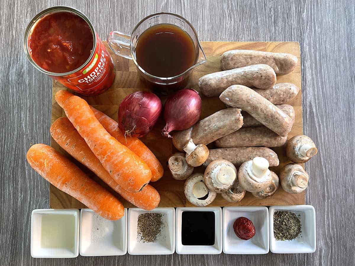 ingredients including sausages, stock, carrots, onions, mushrooms, seasoninh, oil, tomato puree, bovril, herbs.