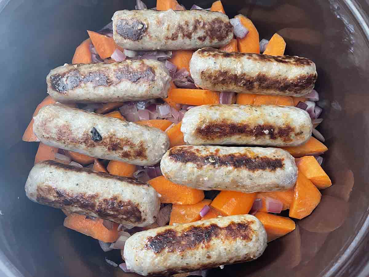 sausages added to slow cooker.