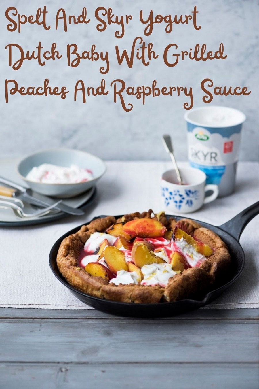 Spelt And Skyr Yogurt Dutch Baby With Grilled Peaches And Raspberry Sauce.